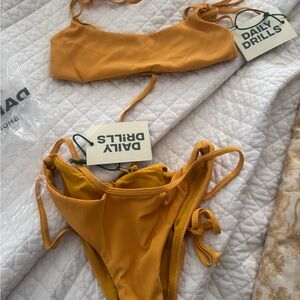 Daily Drills Mustard Yellow Bikini Set. NWT Set in bag.